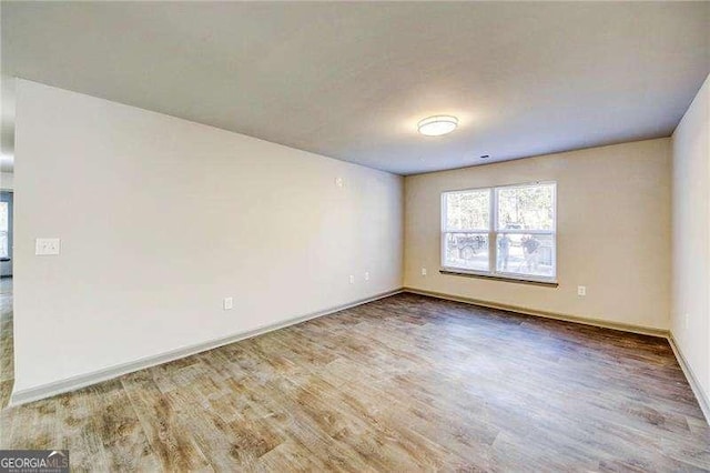 empty room featuring hardwood / wood-style floors