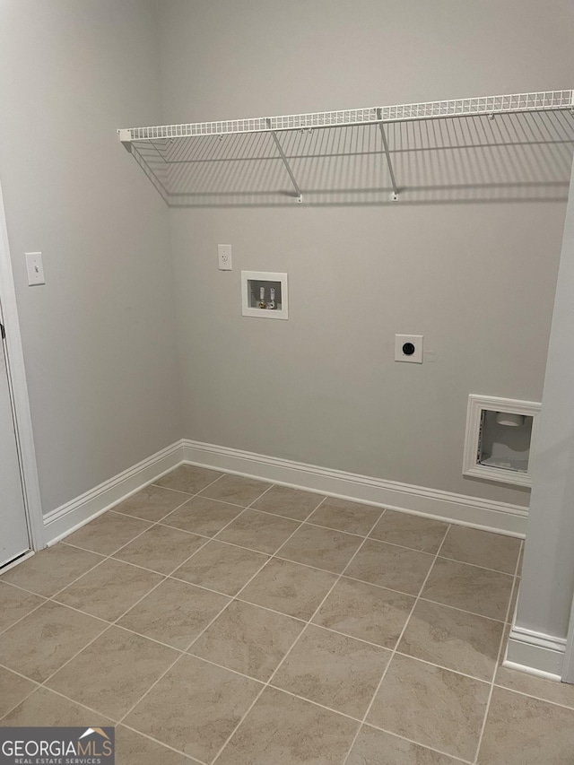 laundry room with hookup for a washing machine, tile patterned flooring, and hookup for an electric dryer