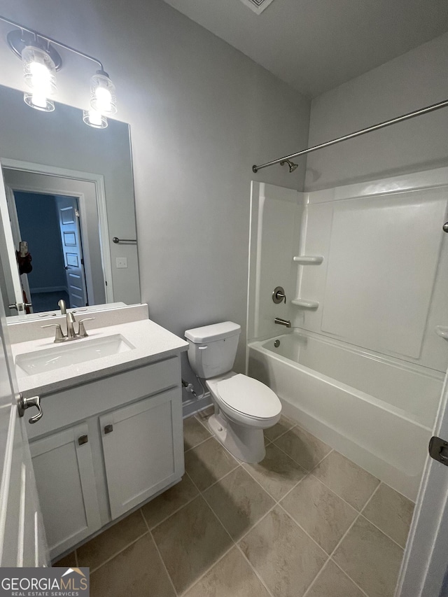 full bathroom with tile patterned floors, vanity, toilet, and washtub / shower combination