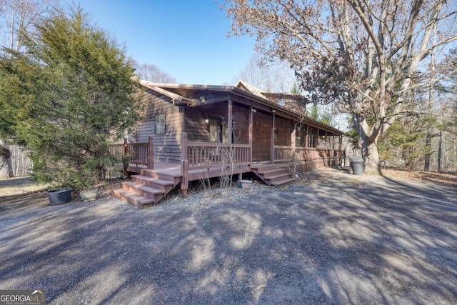 view of front of house featuring a wooden deck