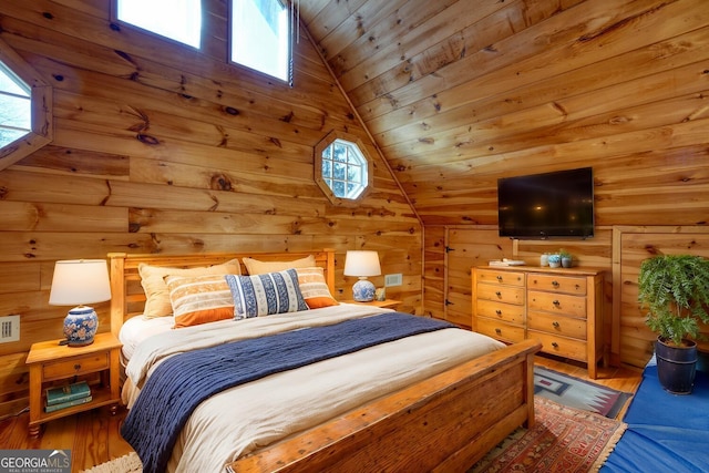 bedroom featuring hardwood / wood-style floors, lofted ceiling, and wood ceiling