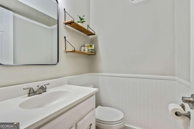 bathroom with vanity and toilet