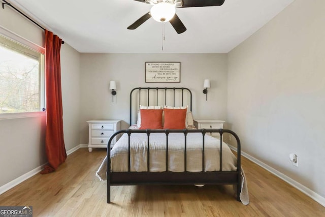 bedroom featuring ceiling fan and light hardwood / wood-style floors