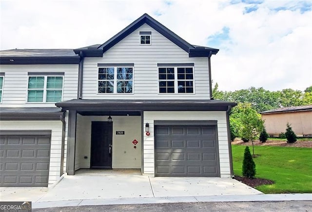 front of property featuring a garage and a front yard