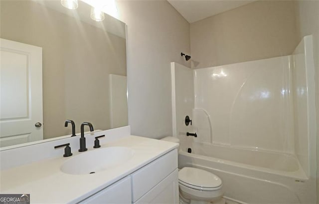 full bathroom with vanity, shower / bathtub combination, and toilet