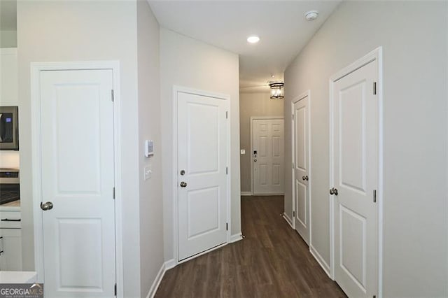 hallway featuring dark wood-type flooring