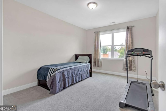 bedroom with light carpet