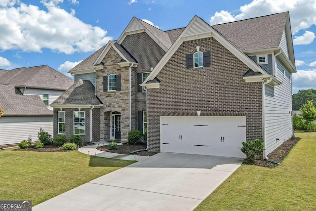 view of front of house with a garage and a front lawn