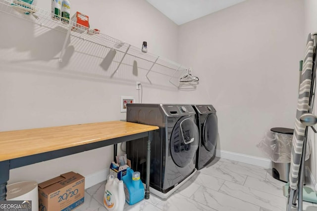 laundry room with independent washer and dryer