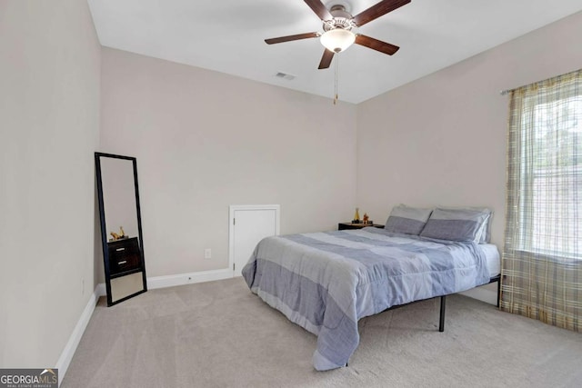 carpeted bedroom featuring ceiling fan