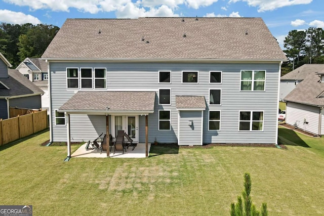 back of house featuring a patio area and a yard