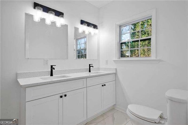 bathroom with vanity and toilet