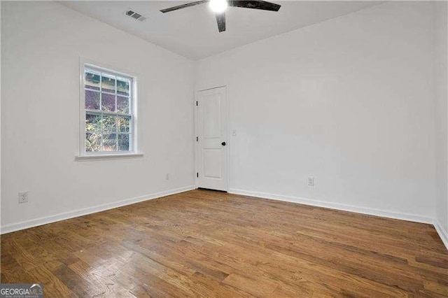 empty room featuring ceiling fan and wood-type flooring