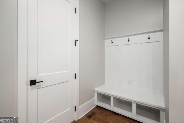 mudroom featuring dark wood-type flooring