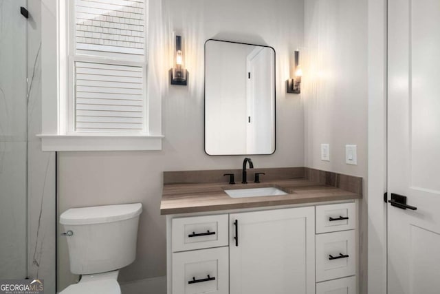 bathroom with vanity and toilet