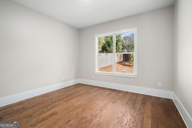 empty room featuring hardwood / wood-style floors