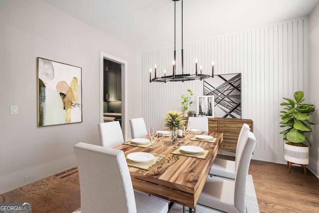 dining area featuring a chandelier and light hardwood / wood-style floors