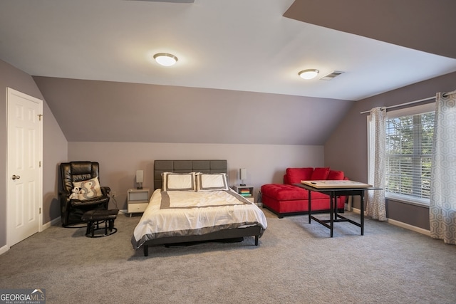 bedroom with carpet and lofted ceiling