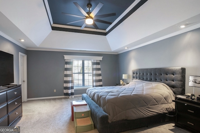 bedroom featuring ceiling fan, a raised ceiling, light carpet, and crown molding