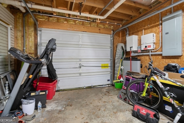 garage featuring electric panel and wooden walls