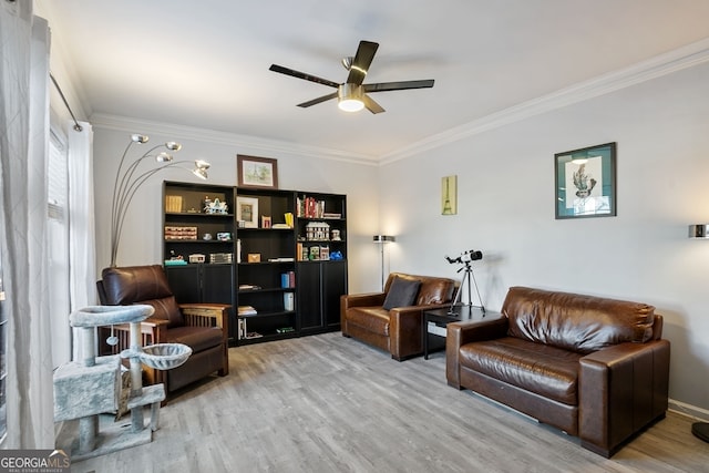 living area featuring ceiling fan, ornamental molding, and light hardwood / wood-style flooring