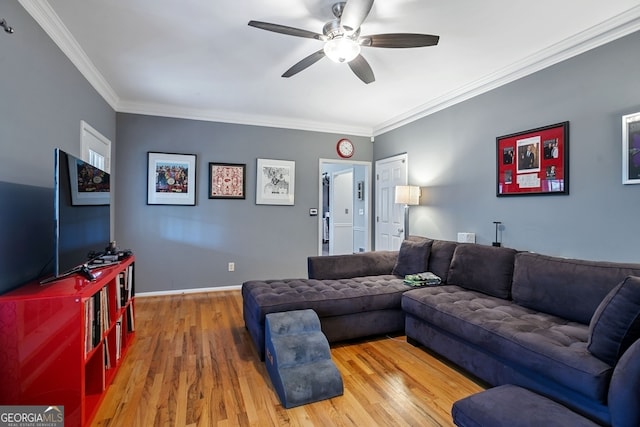 living room with crown molding, ceiling fan, and wood-type flooring