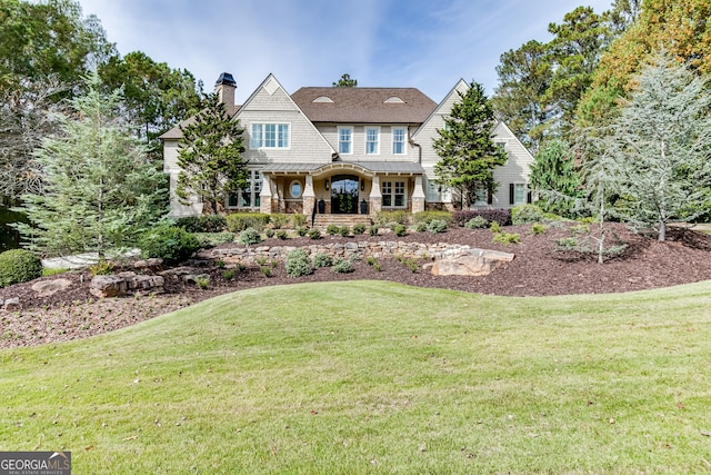 view of front of property with a front lawn