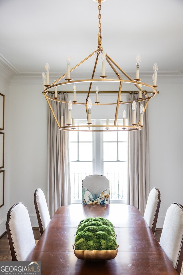 dining space featuring hardwood / wood-style flooring and ornamental molding