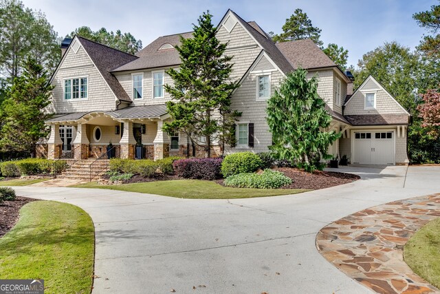 craftsman-style home with a garage and covered porch