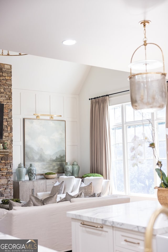 living room featuring vaulted ceiling