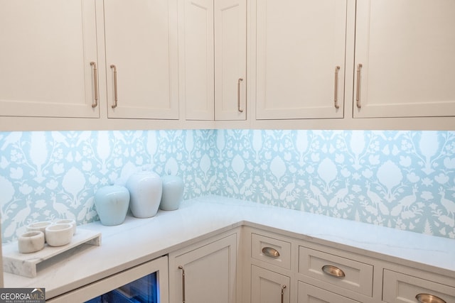 details with beverage cooler and decorative backsplash