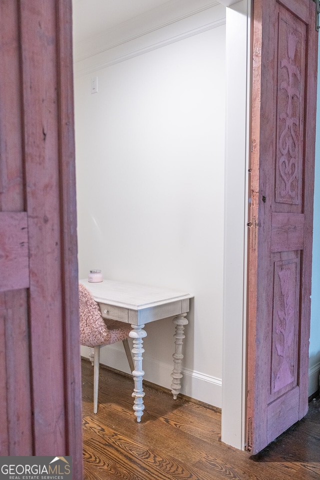 interior details with hardwood / wood-style flooring and crown molding