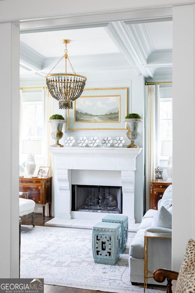 living area featuring coffered ceiling, a notable chandelier, beam ceiling, and wood-type flooring