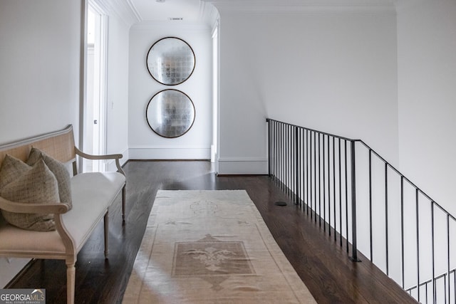 interior space with crown molding and dark hardwood / wood-style flooring