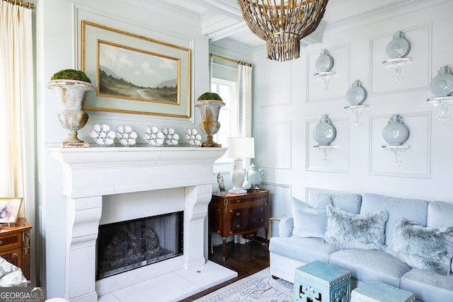 living room featuring a notable chandelier, crown molding, and wood-type flooring