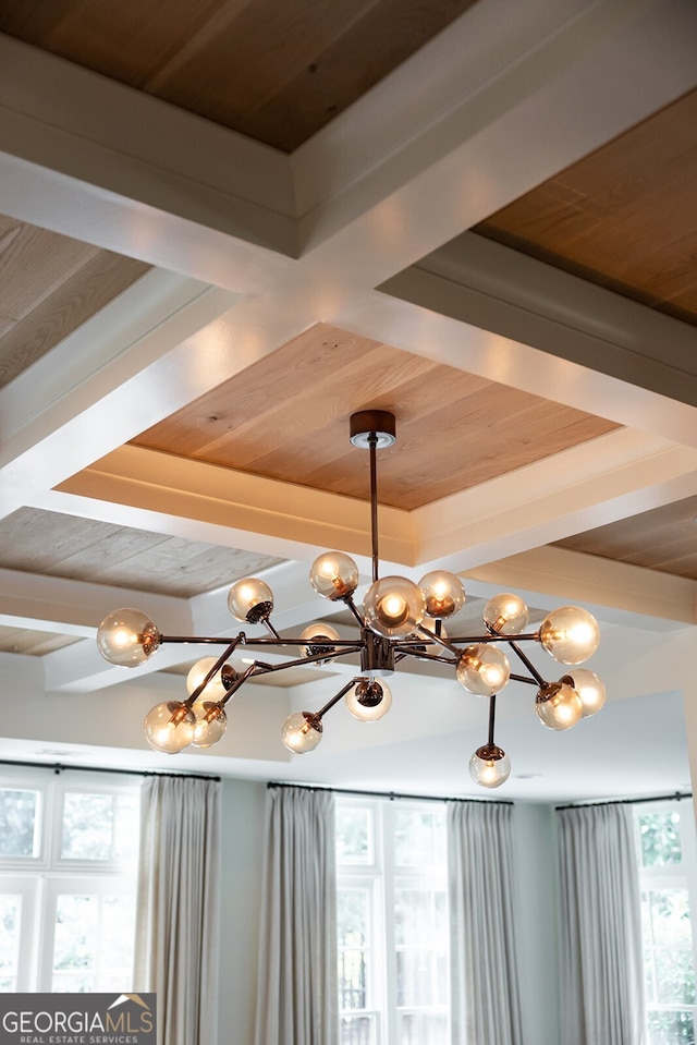 room details featuring a chandelier and wooden ceiling