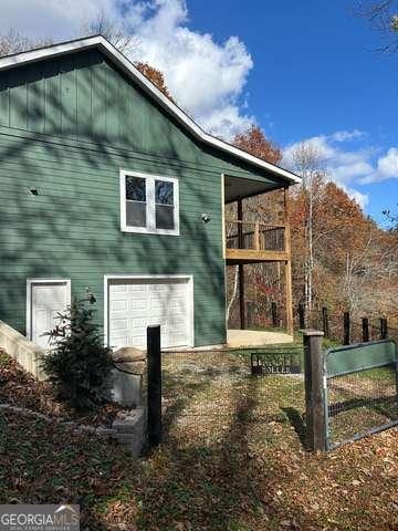 view of property exterior with a garage