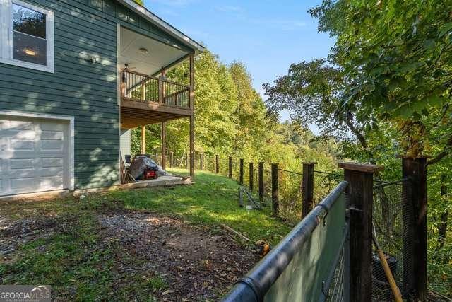 view of yard featuring a balcony