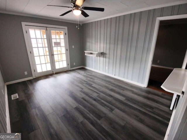 spare room with dark wood-type flooring, ornamental molding, french doors, and ceiling fan