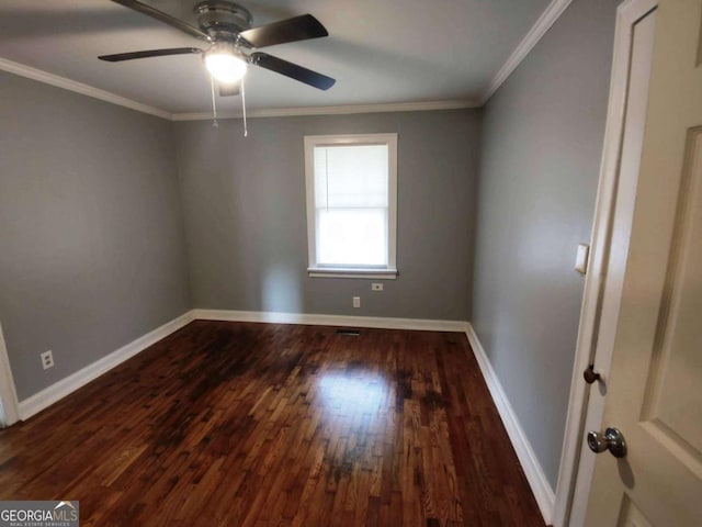 empty room with ceiling fan, dark hardwood / wood-style floors, and crown molding