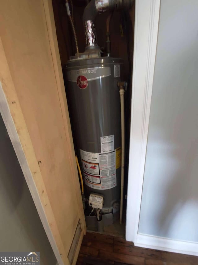 utility room with water heater