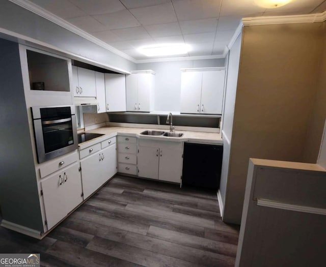 kitchen with white cabinetry, sink, dark hardwood / wood-style floors, stainless steel oven, and black electric cooktop