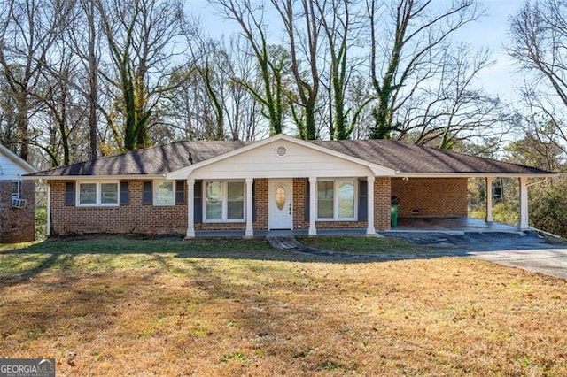 single story home with a front yard and a carport