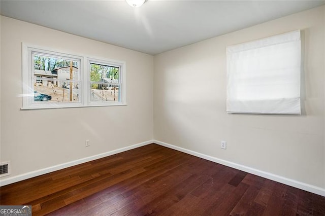 unfurnished room featuring wood-type flooring