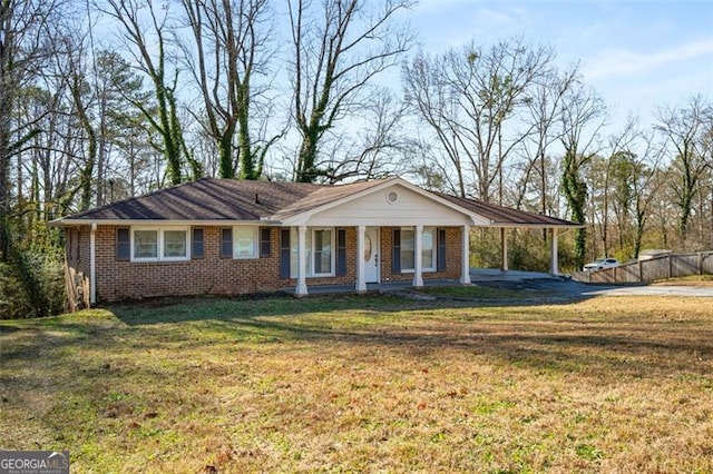 ranch-style house with a porch and a front yard