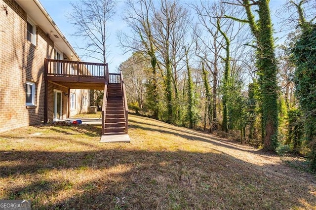 view of yard featuring a wooden deck