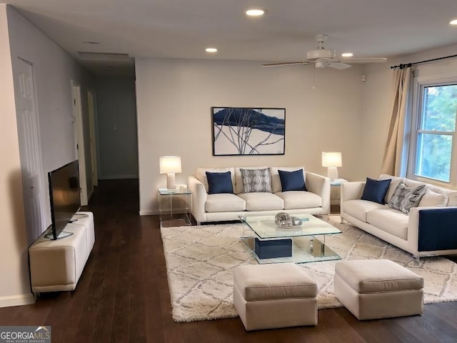 living room with ceiling fan and dark hardwood / wood-style floors