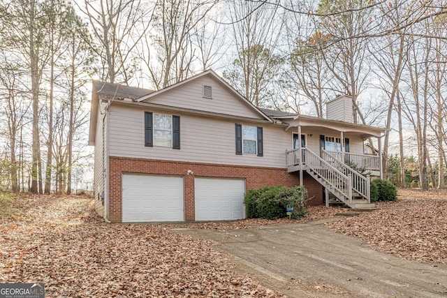 view of front of house featuring a garage and a porch