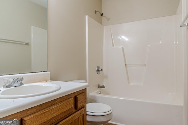 full bathroom featuring vanity,  shower combination, and toilet