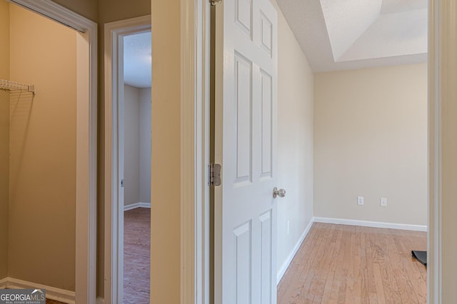 hall with light hardwood / wood-style floors